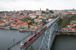 An illustrative photo of a train crossing a bridge over a river