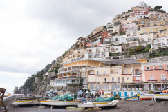 An illustrative photo of buildings and boats.