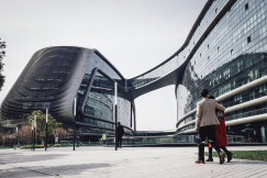 An illustrative photo of a modern glass buidling.