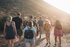 An illustrative photo of people hiking in the mountains.