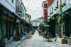 An illustrative photo of people walking on street during daytime.