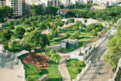 An illustrative photo of a green park in a city.