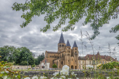 An illustrative photo of a castle with a garden in front of it.