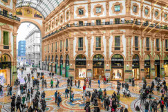 An illustrative photo of a large group of people in a large building.