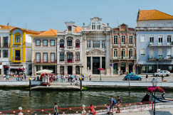 An illustrative photo of group of people beside water.