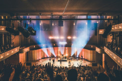 An illustrative photo of people standing on stage.