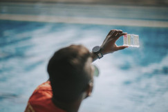 Man checking water pollution levels