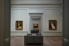An illustrative photo of paintings in a museum.