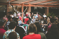 An illustrative photo of people laughing at a party.