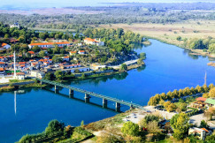 An illustrative photo of a city near a river.