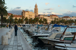 An illustrative photo of a man walking on dock.