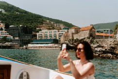 An illustrative photo of a woman taking a picture of herself.