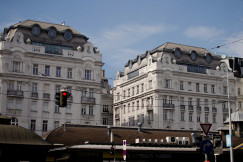 An illustrative photo of a white concrete building.