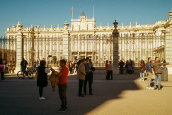An illustrative photo of a group of people standing in front of a building.