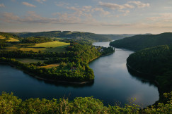 An illustrative photo of a river running through the valley.