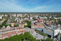 An illustrative photo of a city with tall buildings.