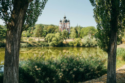 An illustrative photo of a church near a body of water.