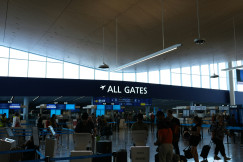 An illustrative photo of a group of people walking through an airport terminal.