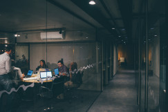 An illustrative photo of a group of people having a meeting.