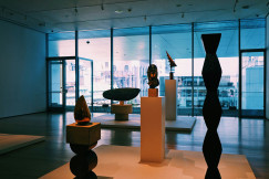 An illustrative photo of a room filled with different types of sculptures.