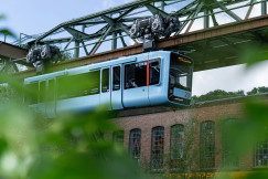 An illustrative photo of a blue train flowing in the air.