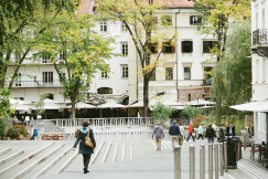An illustrative photo of people walking on sidewalk.