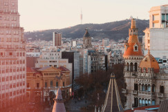 An illustrative photo of a view of a city with tall buildings.