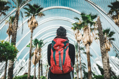 An illustrative photo of a man carrying a backpack.