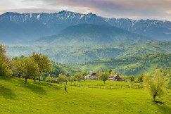 An illustrative photo of a farm in the mountains.
