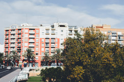 An illustrative photo of a view of a street with a building.