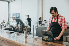 An illustrative photo of people in the kitchen.