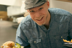 An illustrative photo of a man delivering food.