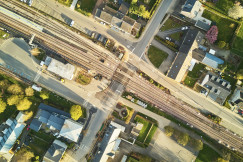 An illustrative photo of railway between houses.