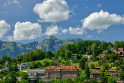 An illustrative photo of houses in the mountains.