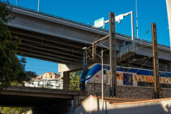 An illustrative photo of a train on a bridge.