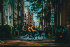 An illustrative photo of a man riding a bike.
