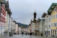 An illustrative photo of a group of people walking down a street.