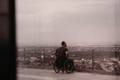 An illustrative photo of a person in a wheelchair.