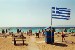 An illustrative photo of a flag on a beach.
