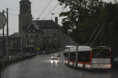 An illustrative photo of a bus driving down a street.