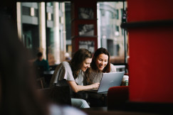 An illustrative photo of woman using a laptop.