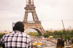 An illustrative photo of a man looking at Eiffel tower.