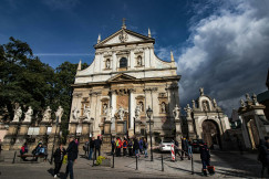 An illustrative photo of a group of people standing in front of a church.