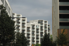 An illustrative photo of a couple of tall buildings.