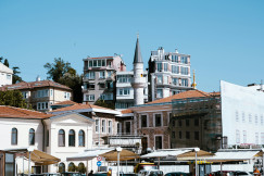 An illustrative photo of buildings sitting on the side of a road.