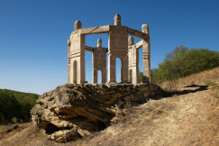 An illustrative photo of a sculptural composition under blue sky.