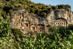 An illustrative photo of statues carved in a mountain.