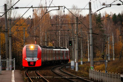 An illustrative photo of an orange train on railroad.