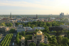 An illustrative photo of a city with trees and buildings.