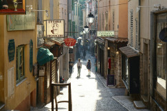 An illustrative photo of people walking between buildings.